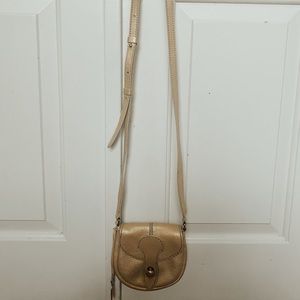 Tod’s gold mini crossbody bag